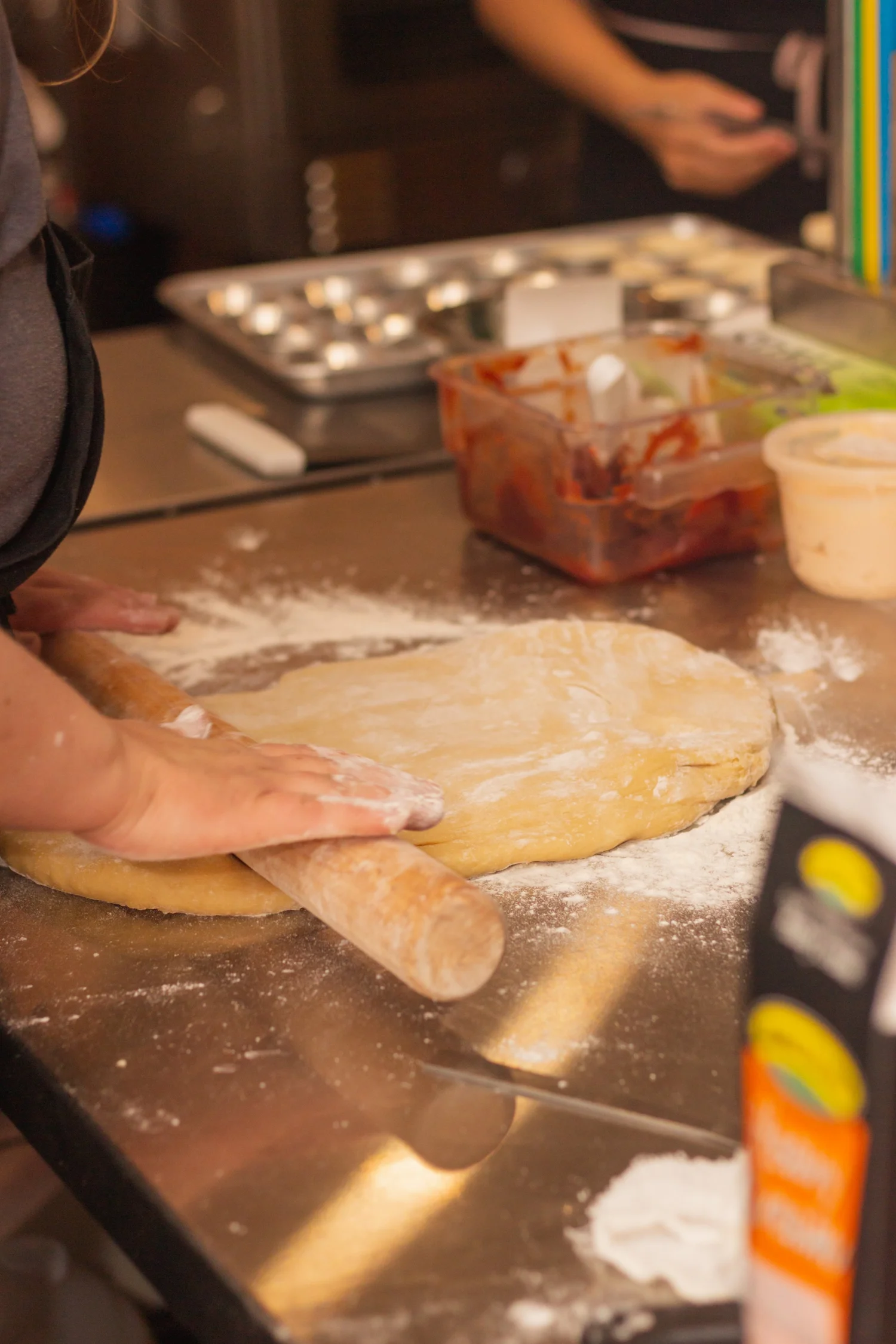 Rolling dough at the counter